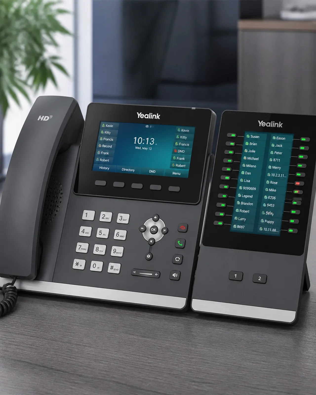 Closeup of an IP phone with an expansion module showing glowing status lights
