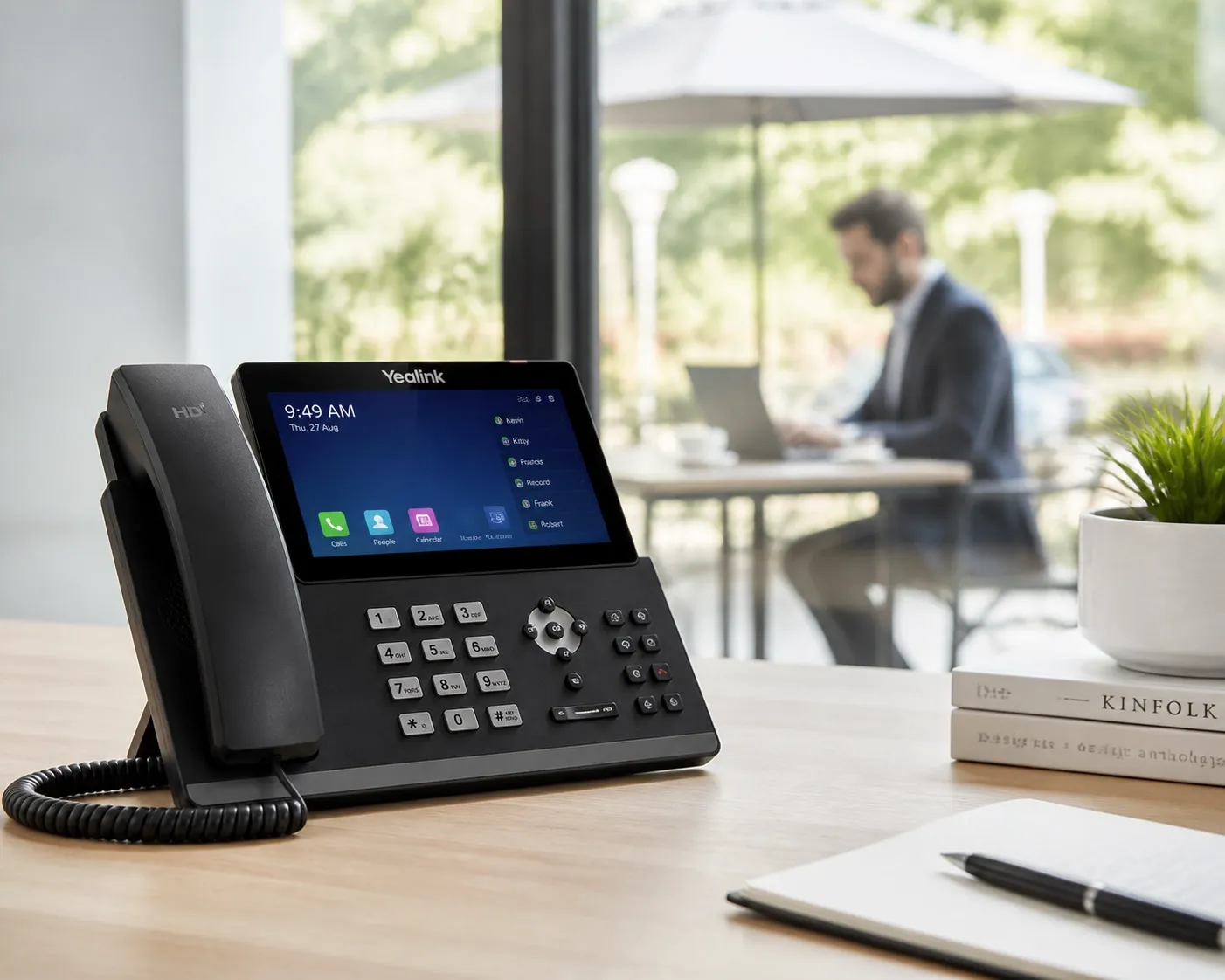 Modern IP desk phone on a minimalist desk representing professional business VoIP Canada hybrid office solutions.